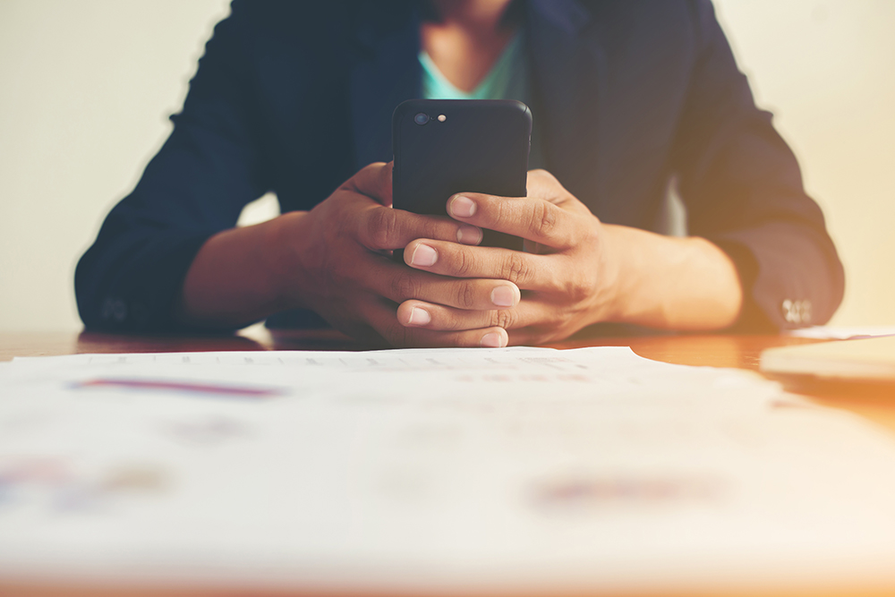 person on their digital device looking at news